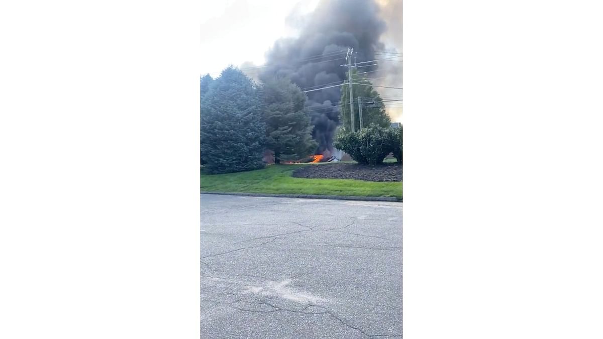 Smoke rises from the wreckage after a plane crashed into the Trumpf Inc. building in Farmington, Connecticut, US, in this still image taken from a video obtained from social media. Credit: Pedro Martinez/via Reuters