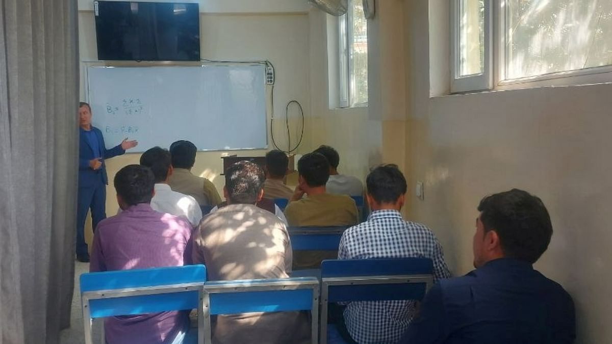 Students attend class under new classroom conditions at Avicenna University in Kabul, Afghanistan. Credit: Reuters Photo