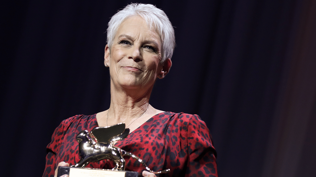 Actor Jamie Lee Curtis poses with a Golden Lion award for lifetime achievement. Credit: Reuters Photo
