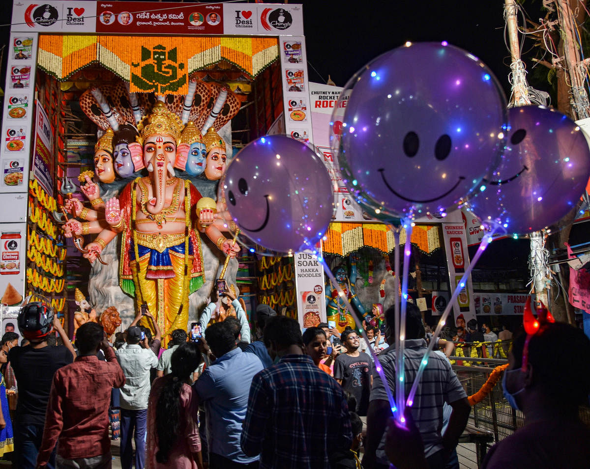 Devotees visit the Khairthabad's Shri Panchamukha Rudra Maha Ganapati on the occasion of Ganesh Chaturthi festival in Hyderabad, Telangana. Credit: PTI Photo