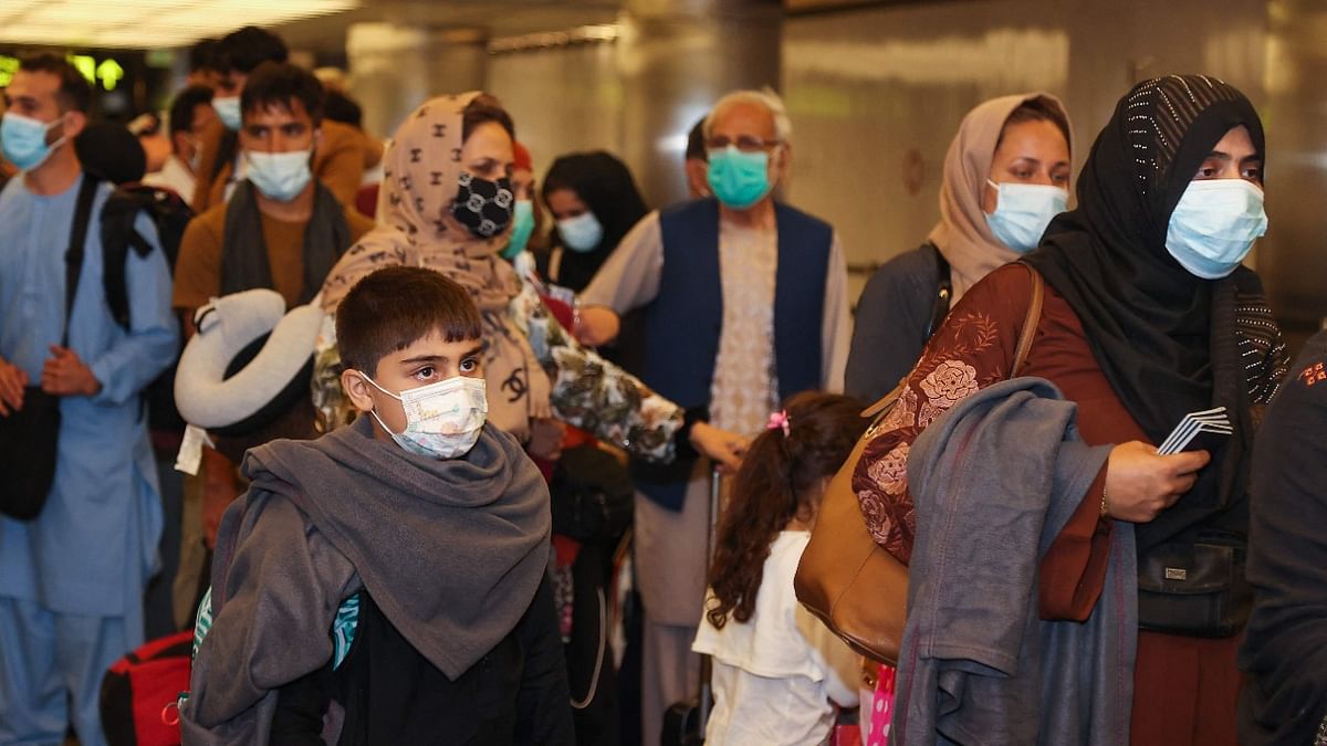 Evacuees from Afghanistan arrive at Hamad International Airport in Qatar's capital Doha. Credit: AFP Photo