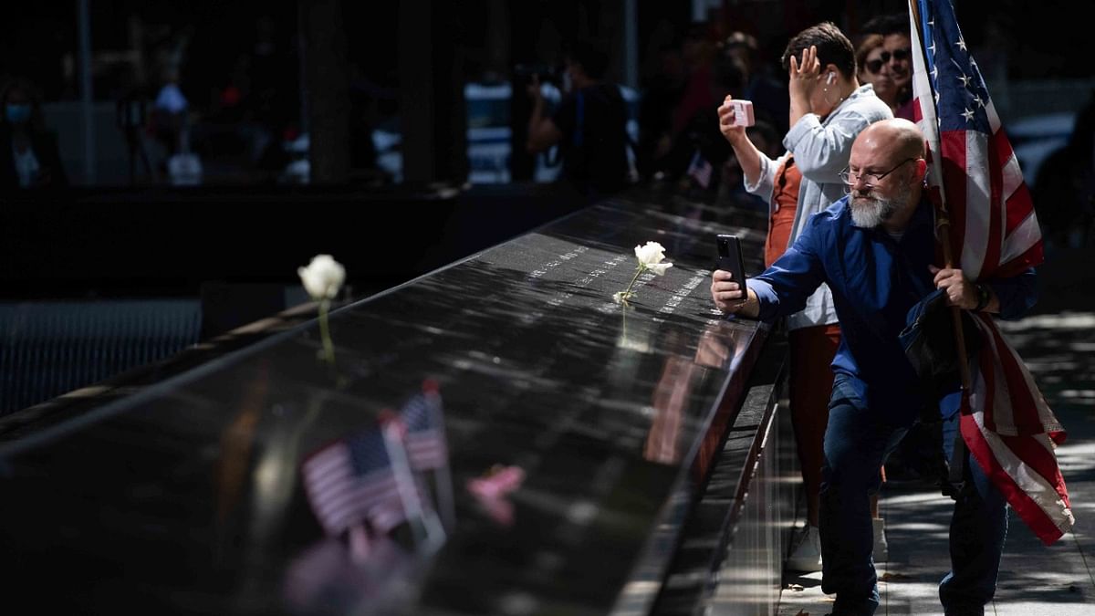 Whether to take a picture or to remember their loved ones, Ground Zero, which is the site of the old World Trade Centre, continues to serve as a reminder of 9/11 | Credit: AFP Photo