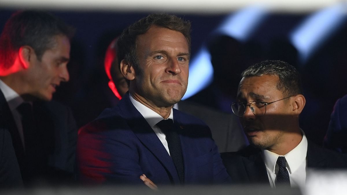 French President Emmanuel Macron (L) and French boxer Brahim Asloum (R) attend and EBU European Union heavyweight title boxing match between France's Tony Yoka and Croatia's Petar Milas at the Roland-Garros complex in Paris. Credit: AFP Photo