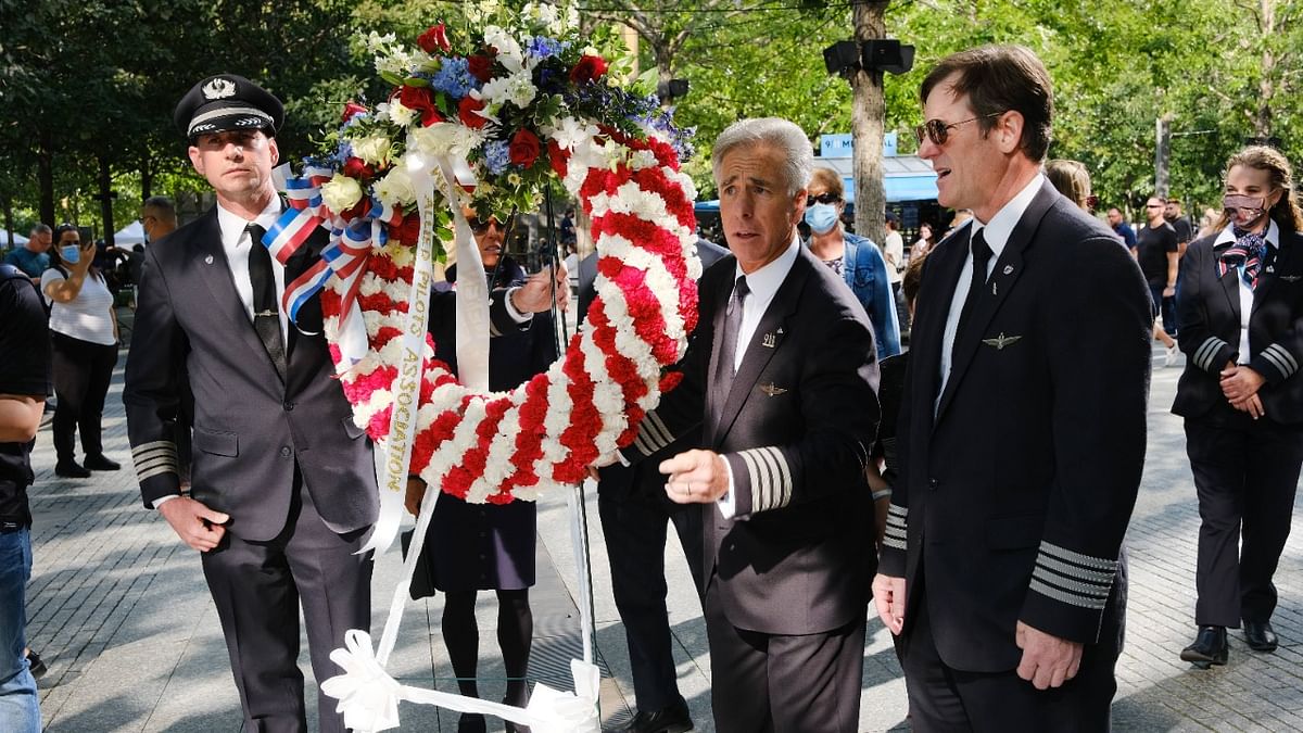 Pilots and airline workers from both United and American Airlines participated in a wreath laying ceremony for their colleagues who were killed on September 11 at the September 11th Memorial in New York City | Credit: AFP Photo