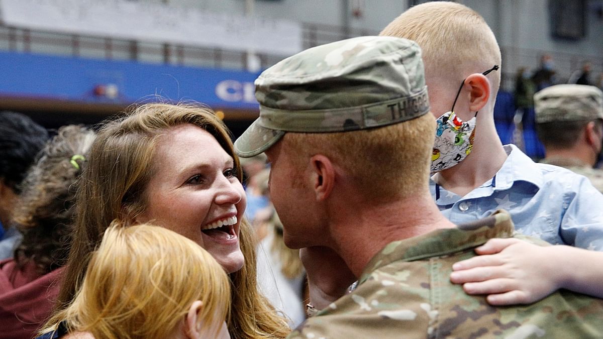 Family members greet a soldier with the 4th Battalion, 31st Infantry Regiment, 2nd Brigade Combat Team of the 10th Mountain Division, upon his return home from deployment in Afghanistan, at Fort Drum in New York, US. Credit: Reuters Photo