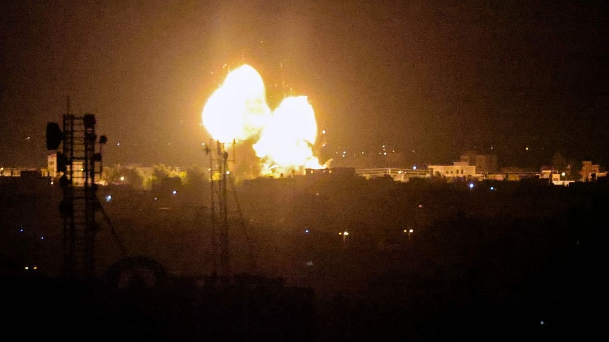 A fireball rises following an air strike in Rafah in the southern Gaza Strip. Credit: AFP Photo