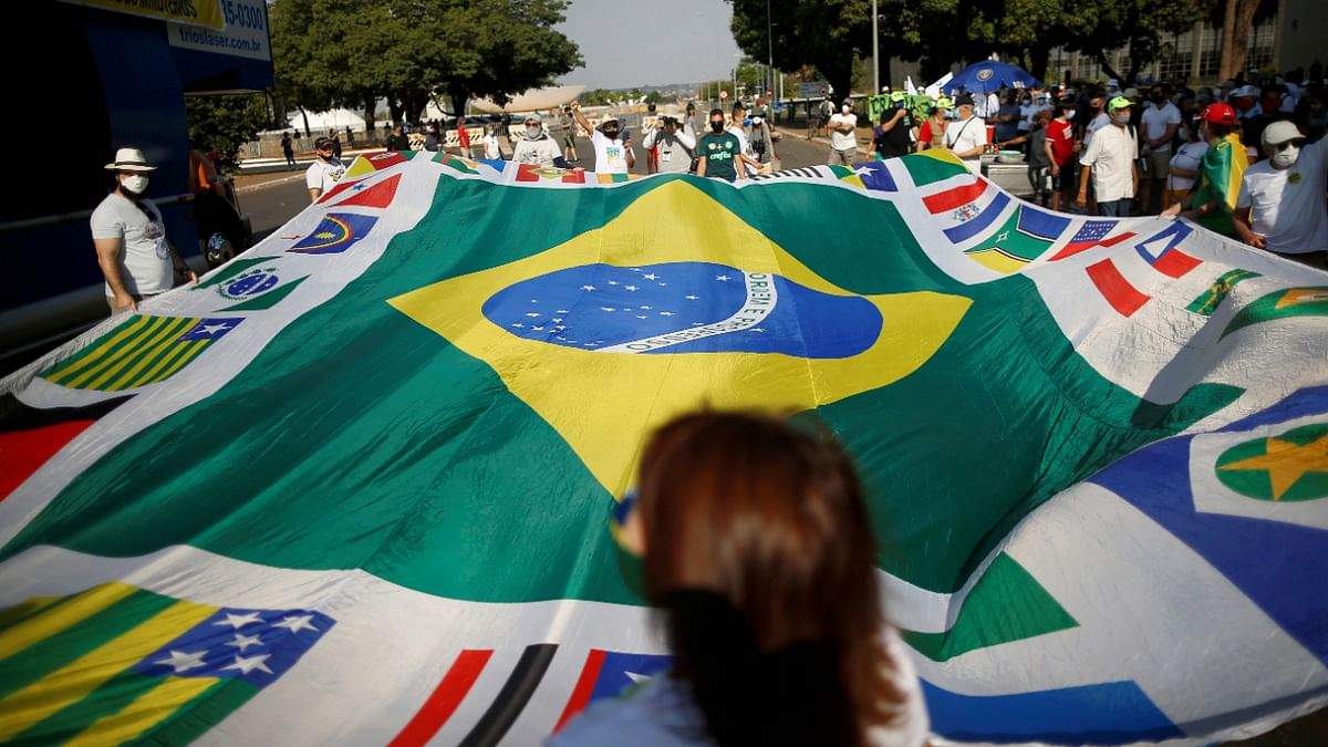 Demonstrators take part in a protest against President Jair Bolsonaro's government, in Brasilia, Brazil. Credit: Reuters Photo