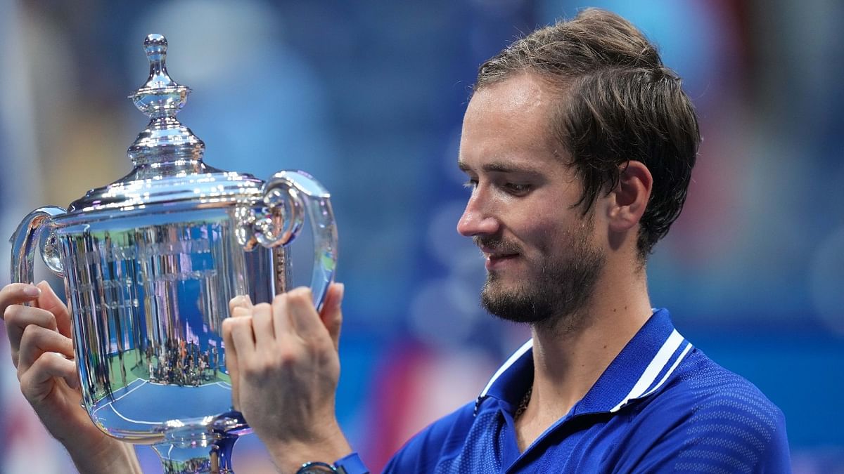 Daniil Medvedev of Russia celebrates with the championship trophy after defeating Novak Djokovic of Serbia in the US Open final. Credit: Reuters Photo