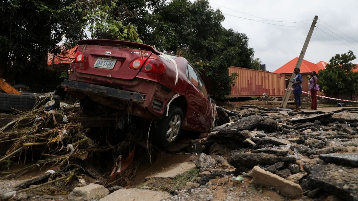 A car washed away during the flooding which destroyed several homes at Trademore estate Abuja, Nigeria. Credit: Reuters Photo