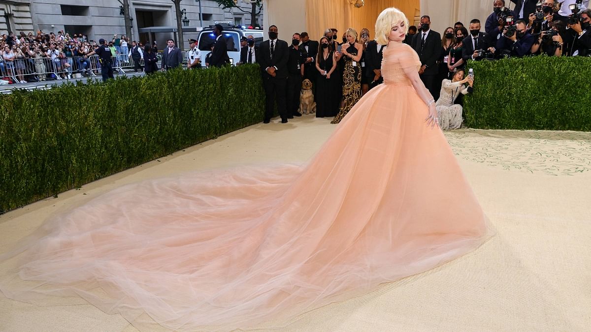 Grammy-winner Eilish, 19, shed her trademark baggy clothes for a plunging Oscar de La Renta peach gown that she said was inspired by Marilyn Monroe. Credit: AFP Photo