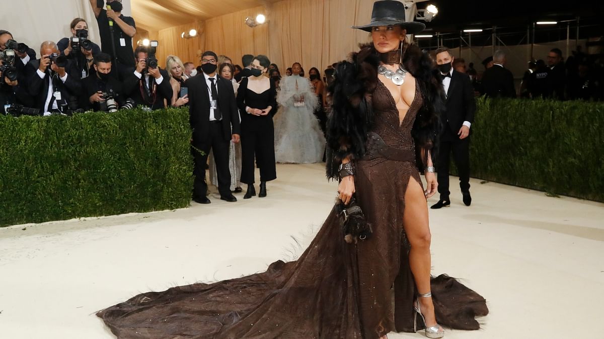 Jennifer Lopez sported a Western black hat over a plunging bronze gown and fur jacket. Credit: Reuters Photo
