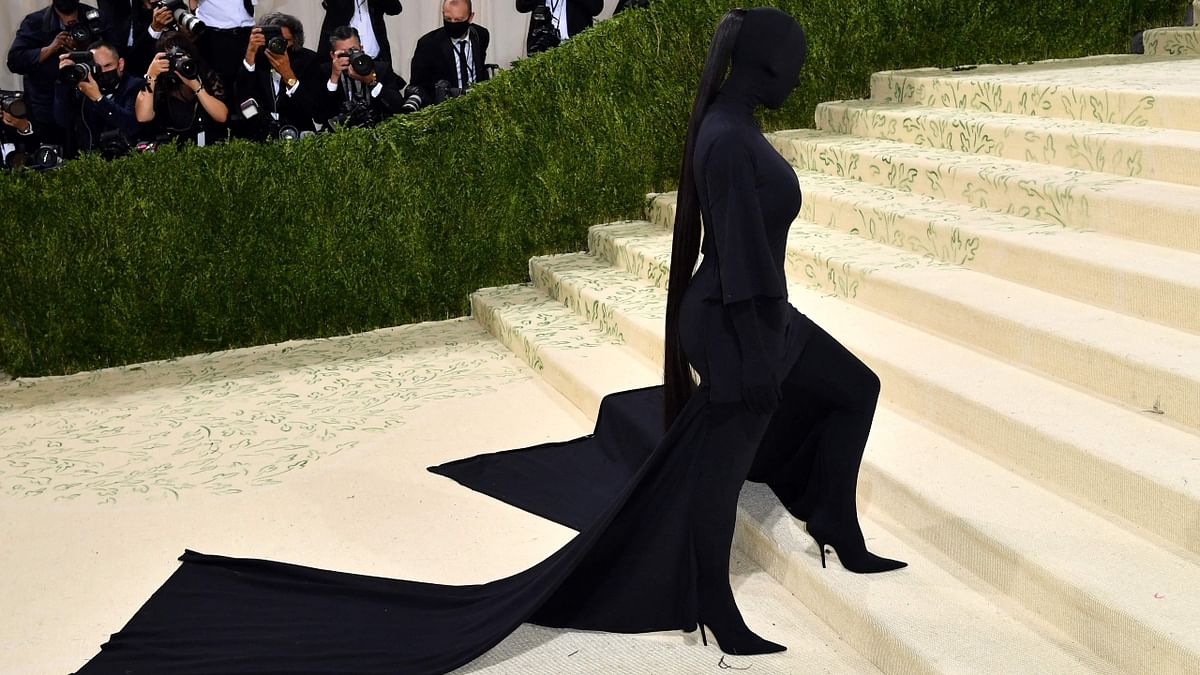 Kim Kardashian, wearing Balenciaga, turned heads by dressing entirely in black, with even her face covered in thick black fabric. Credit: AFP Photo