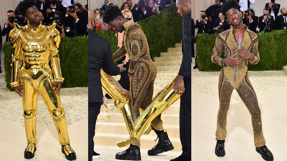 Lil Nas X, the musician behind hit song 'Old Town Road', wowed with a gold suit of armor that he took off to reveal a crystal-inspired bodysuit. Credit: AFP Photo