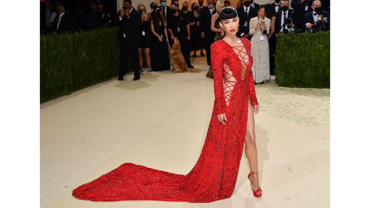 Megan Fox wowed all in a sexy red lace-up gown with thigh-slit. Credit: AFP Photo