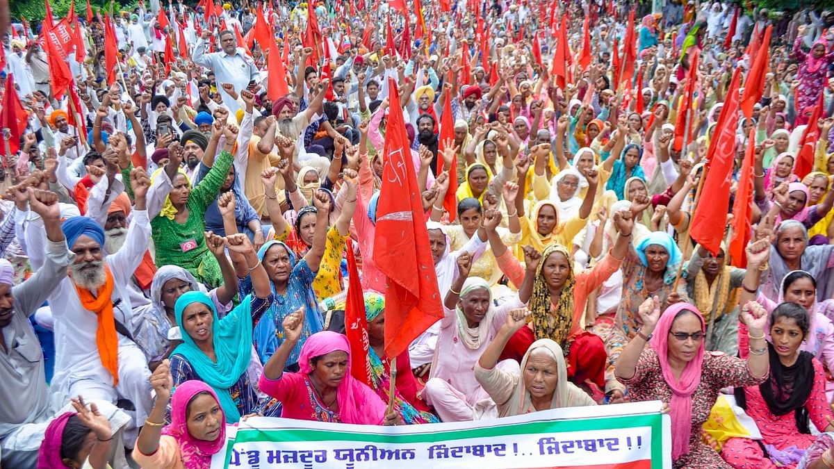 Members of Rural Labour Union Punjab block the Mall road during a protest against Punjab government in support of their demands in Patiala. Credit: PTI Photo