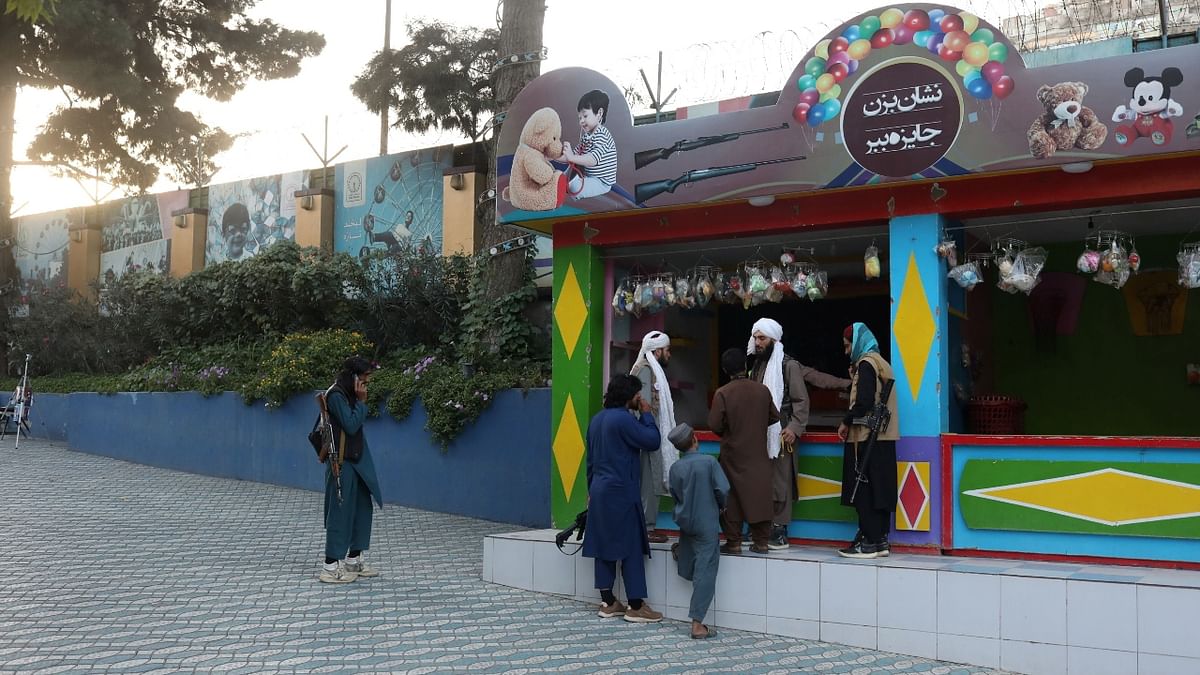 Taliban soldiers stand guard at an amusement park in Kabul, Afghanistan. Credit: Reuters Photo