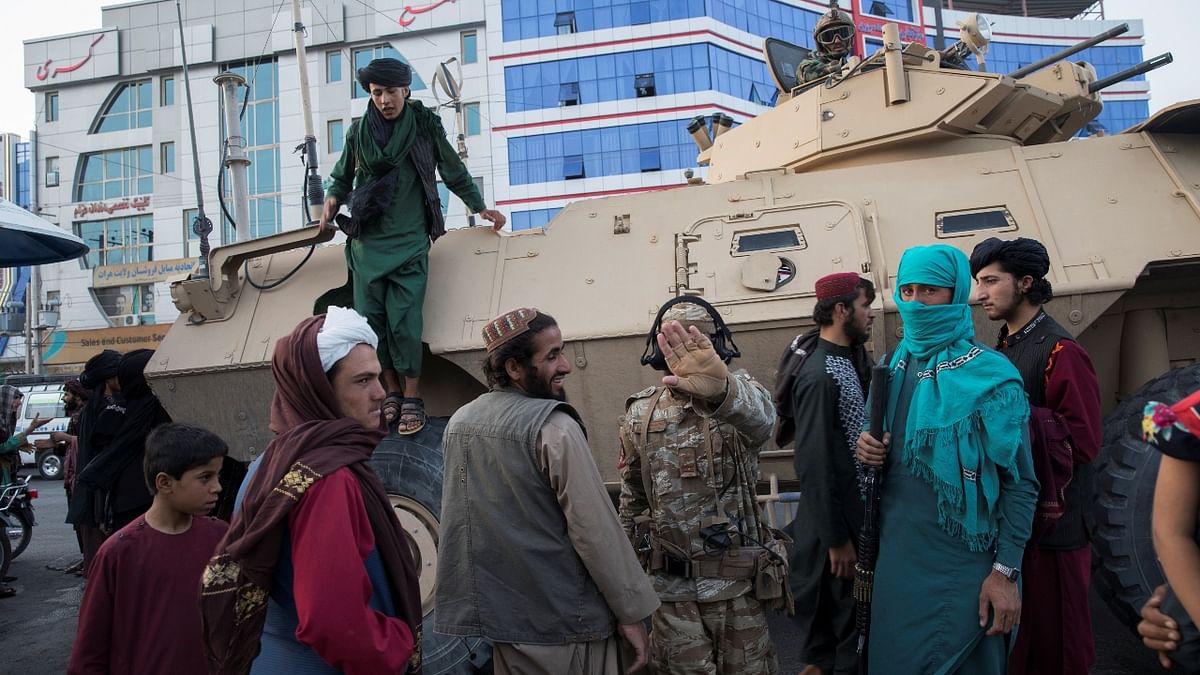 Taliban soldiers are seen in a street in Herat, Afghanistan. Credit: Reuters Photo