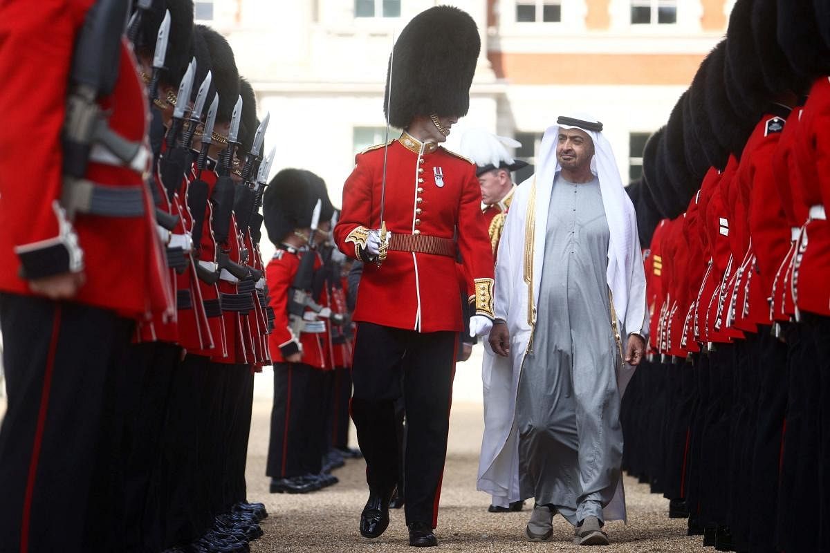 Crown Prince of Abu Dhabi, Mohamed bin Zayed Al Nahyan (R) inspects the Grenadier Guards in central London. Credit: AFP Photo
