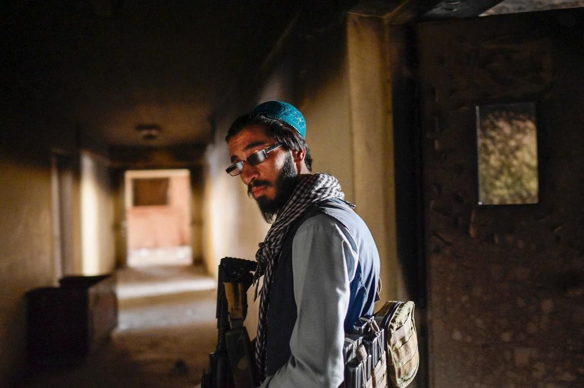 A member of the Taliban walks inside the Pul-e-Charkhi prison in Kabul. Credit: AFP Photo