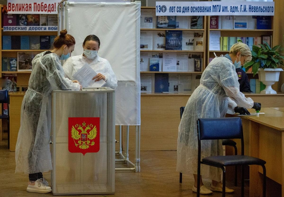 Members of a local election commission get ready for voting on the first day of a three-day long parliamentary elections in the far eastern city of Vladivostok, Russia. Credit: Reuters Photo