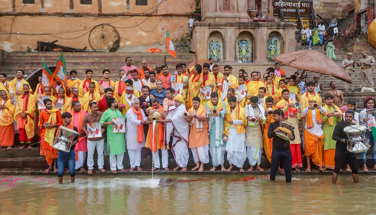 Priests along with BJP supporters perform rituals on the banks of river Ganga on the eve of of Prime Minister Narendra Modi’s 71st birthday, in Varanasi. Credit: PTI Photo