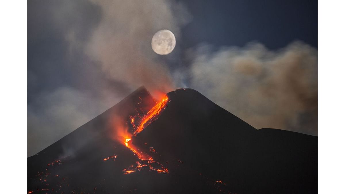 Skyscapes Runner-Up: Moon Over Mount Etna South-East Crater. Credit: Royal Observatory Greenwich’s Astronomy Photographer of the Year 13 (2021) competition/exhibition - Dario Giannobile (Italy)