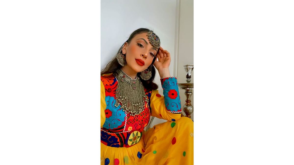 A woman poses in traditional Afghan attire, in Stavanger, Norway. Credit: Twitter/@dressingsonnets