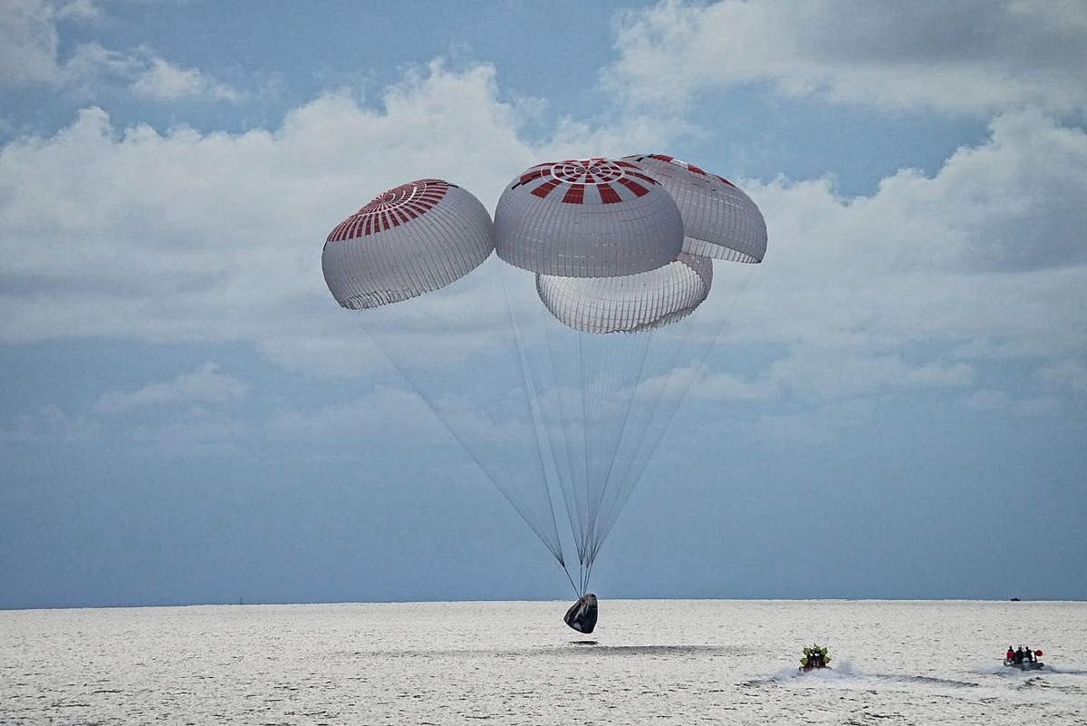 The quartet of newly minted citizen astronauts comprising the SpaceX Inspiration4 mission safely splashes down in SpaceX's Crew Dragon capsule off the coast of Kennedy Space Center, Florida. Credit: Reuters Photo