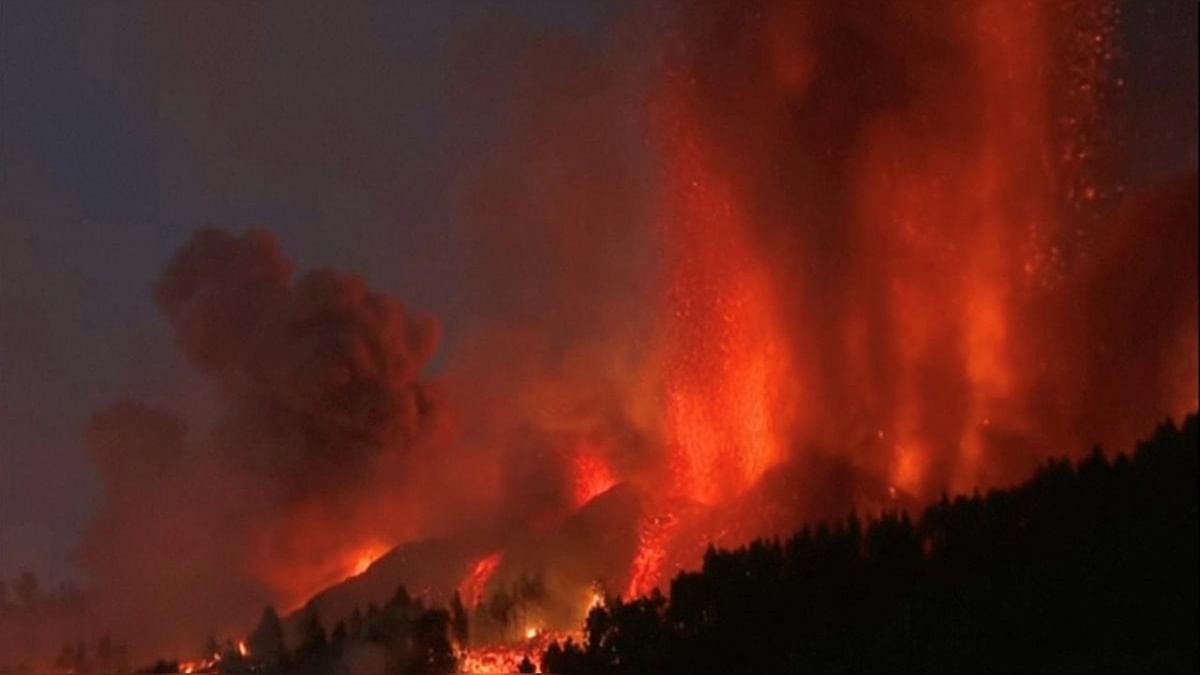 Lava pours out of a volcano in the Cumbre Vieja national park at El Paso, on the Canary Island of La Palma, in this screen grab taken from a video. Credit: Reuters photo/FORTA/Handout