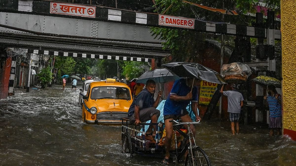 There were fewer vehicles on the streets since morning, but traffic snarls were caused owing to very slow movement because of submerged thoroughfares. People trying to go to work had a tough time getting public transport as the strength of public buses and taxis was much depleted owing to the torrential rains. Credit: AFP Photo