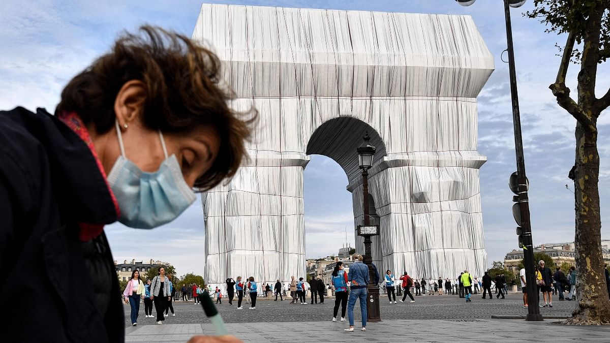 Roselyne Bachelot, the culture minister, said: “The Arc de Triomphe is taken away from our gaze and at the same time overexposed to our gaze. This subtraction and this overexposure lie at the core of the work. Thank you, Christo, for offering us the gift of looking in another way, in a new way, at masterpieces built by other artists.” Credit: AFP Photo
