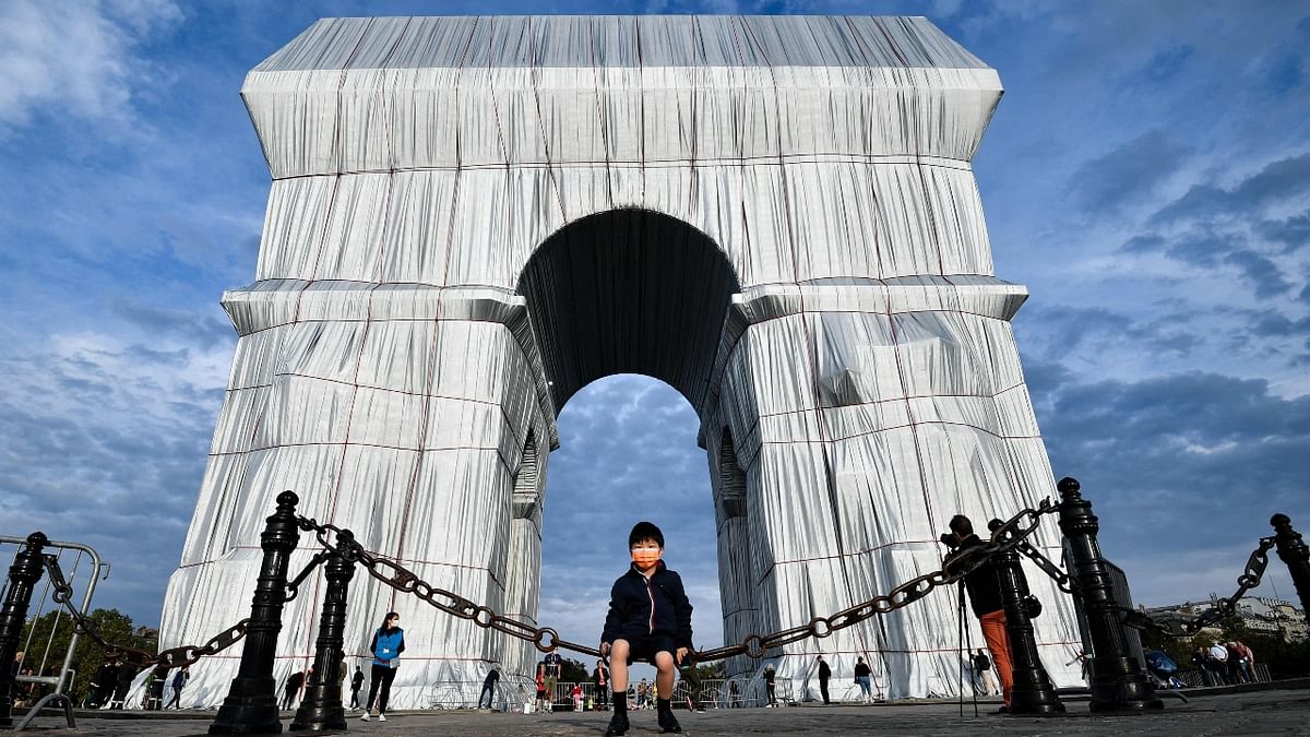 At weekends, the Arc de Triomphe's traffic-heavy roundabout will be entirely pedestrianized.  Visitors to the famous Napoleonic arch, which dominates the Champs-Elysees Avenue, will not only be able to see the gleaming fabric, but to touch it too — as the artists had intended. Credit: AFP Photo