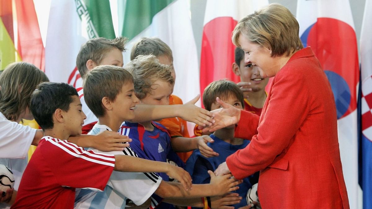 The home team finished third, but after Germans dared to wave their flags joyously again, Time magazine branded Merkel
