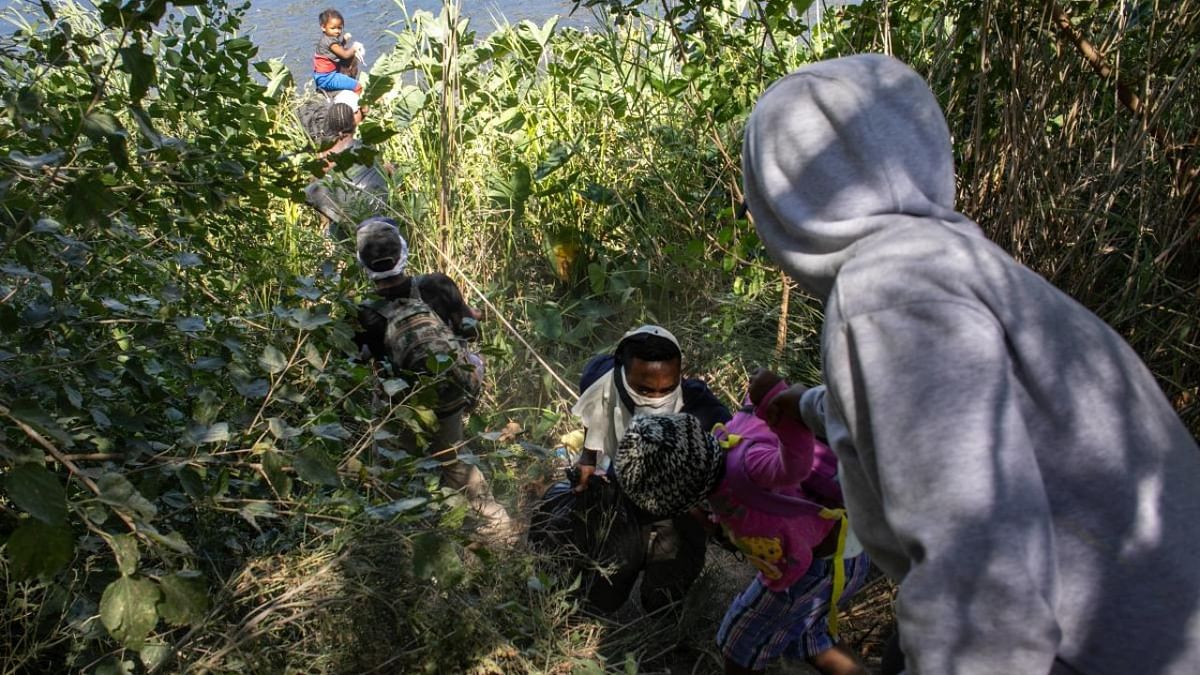 Haitian migrants prepare to cross the Rio Grande from Mexico to Del Rio, Texas on September 23, 2021 in Ciudad Acuna, Mexico. Credit: AFP Photo