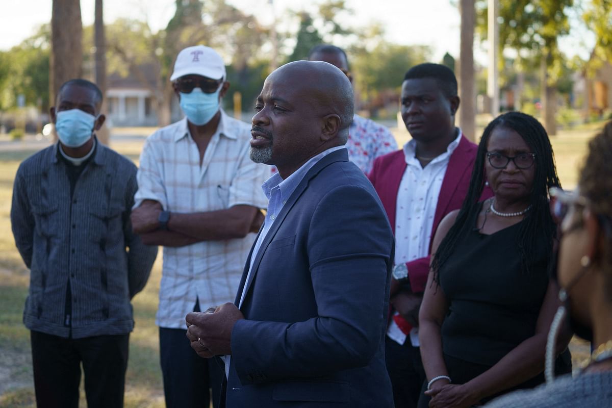 Pastor Keny Felix, of Bethel Evangelical Baptist Church in Miami, expresses his concerns and frustration with other Haitian community leaders about the deportations of Haitians who were in the encampment under Del Rio-Acuna International Bridge in Del Rio, Texas. Credit: AFP Photo