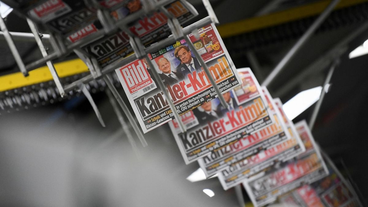 Printed editions of Bild newspaper show candidates for chancellor Olaf Scholz, of Social Democratic Party (SPD), and Armin Laschet, of Christian Democratic Union (CDU), after the first exit polls for the general elections in Berlin, Germany. Credit: Reuters Photo