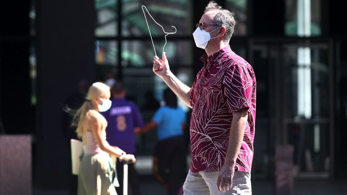 A pro-choice activist holds up a wire clothes hanger as he demonstrates in the federal building plaza while a press conference was being held to call for an end to bans on abortions. Credit: AFP Photo