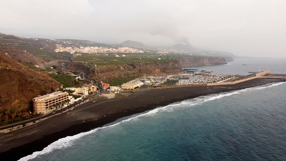 Smoke rises following the eruption of a volcano, in the Port of Tazacorte, on the Canary Island of La Palma, Spain. Credit: Reuters Photo