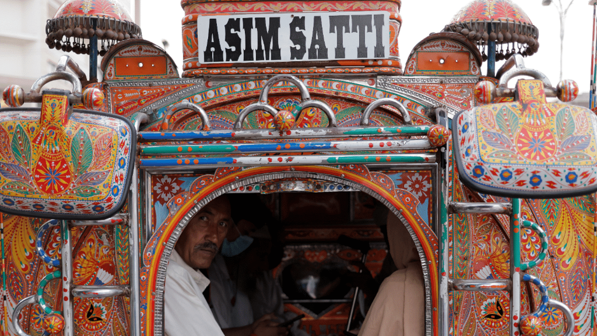 A man looks on from a public transportation vehicle in Rawalpindi, the neighbor city of Islamabad. Credit: Reuters Photo