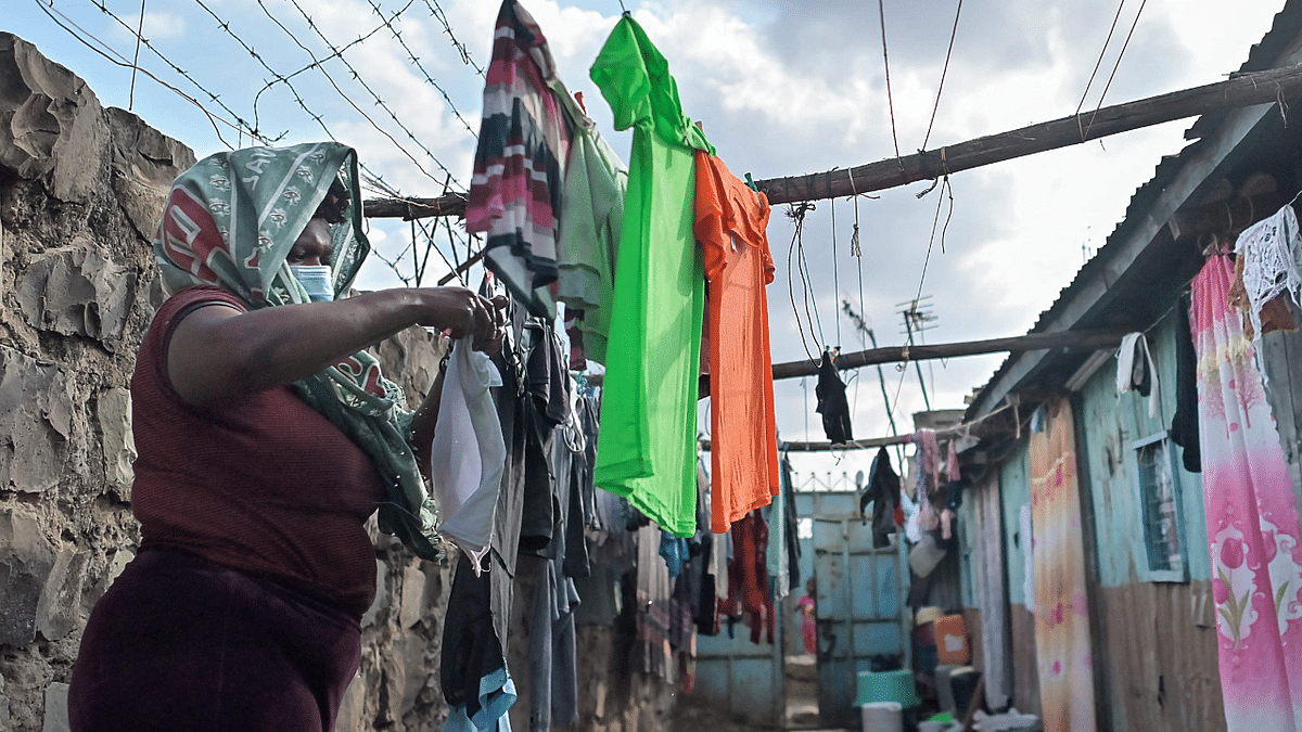 A victim of sexual violence hangs her laundry outside her house in Nairobi's Dandora slum. Kenya's constitution eased access to abortions in 2010 but the overwhelming stigma surrounding the procedure means that many women resort to traditional practices, backstreet procedures that put their life in jeopardy. Credit: AFP Photo
