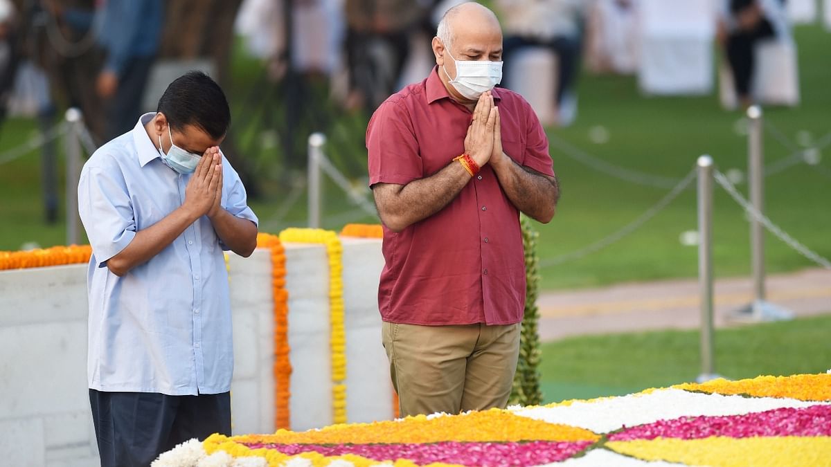 Delhi Chief Minister Arvind Kejriwal and Deputy CM Manish Sisodia pay homage to Mahatma Gandhi on the occasion of his birth anniversary, at Rajghat in New Delhi. Credit: PTI Photo
