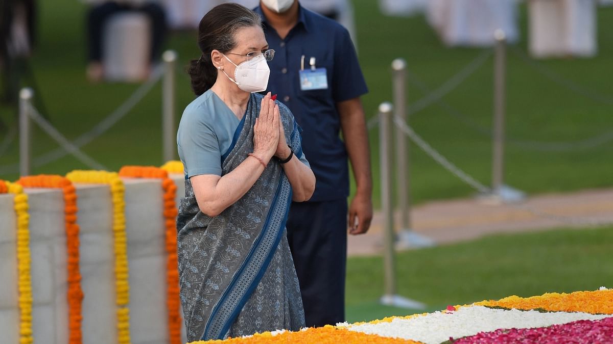 Congress President Sonia Gandhi pays homage to Mahatma Gandhi at Rajghat, in New Delhi. Credit: PTI Photo
