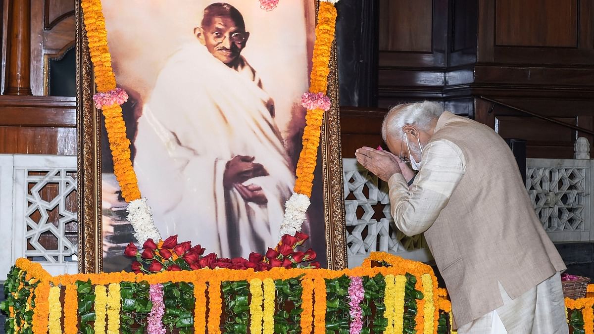 Prime Minister Narendra Modi pays tribute to Mahatma Gandhi on his birth anniversary at Parliament House, in New Delhi. Credit: PTI Photo