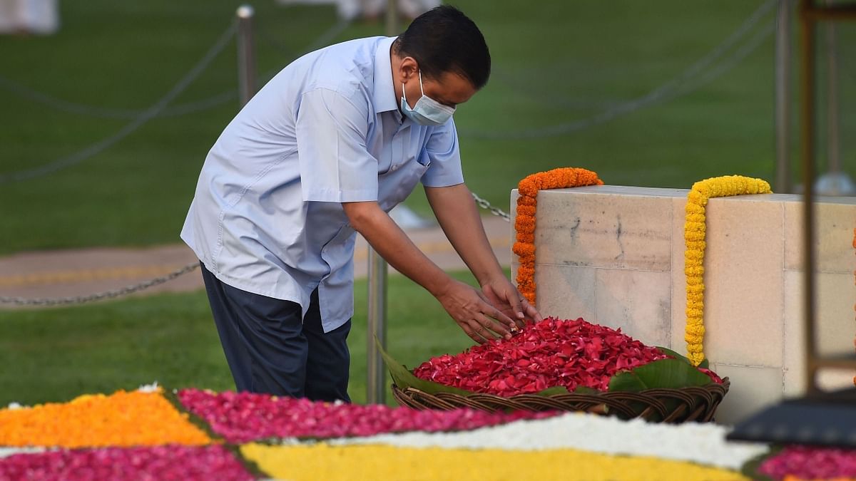 Delhi Chief Minister Arvind Kejriwal pays homage to Mahatma Gandhi on the occasion of his birth anniversary, at Rajghat in New Delhi. Credit: PTI Photo