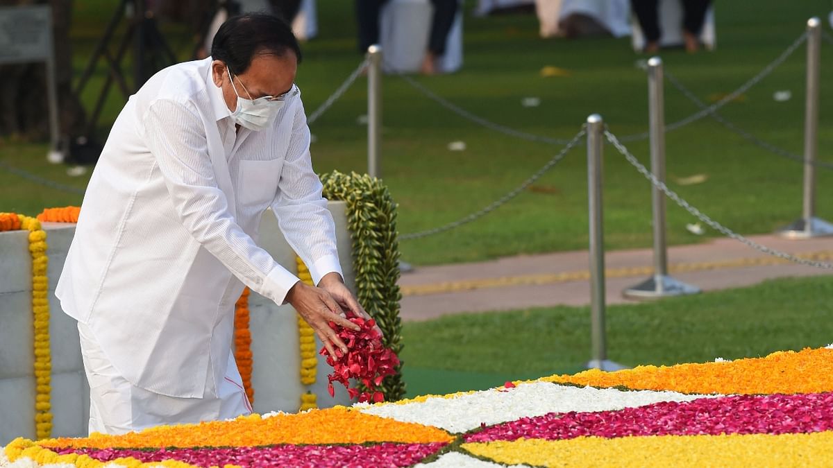 Vice President M Venkaiah Naidu pays homage to Mahatma Gandhi on the occasion of his 152nd birth anniversary, at Rajghat in New Delhi. Credit: PTI Photo