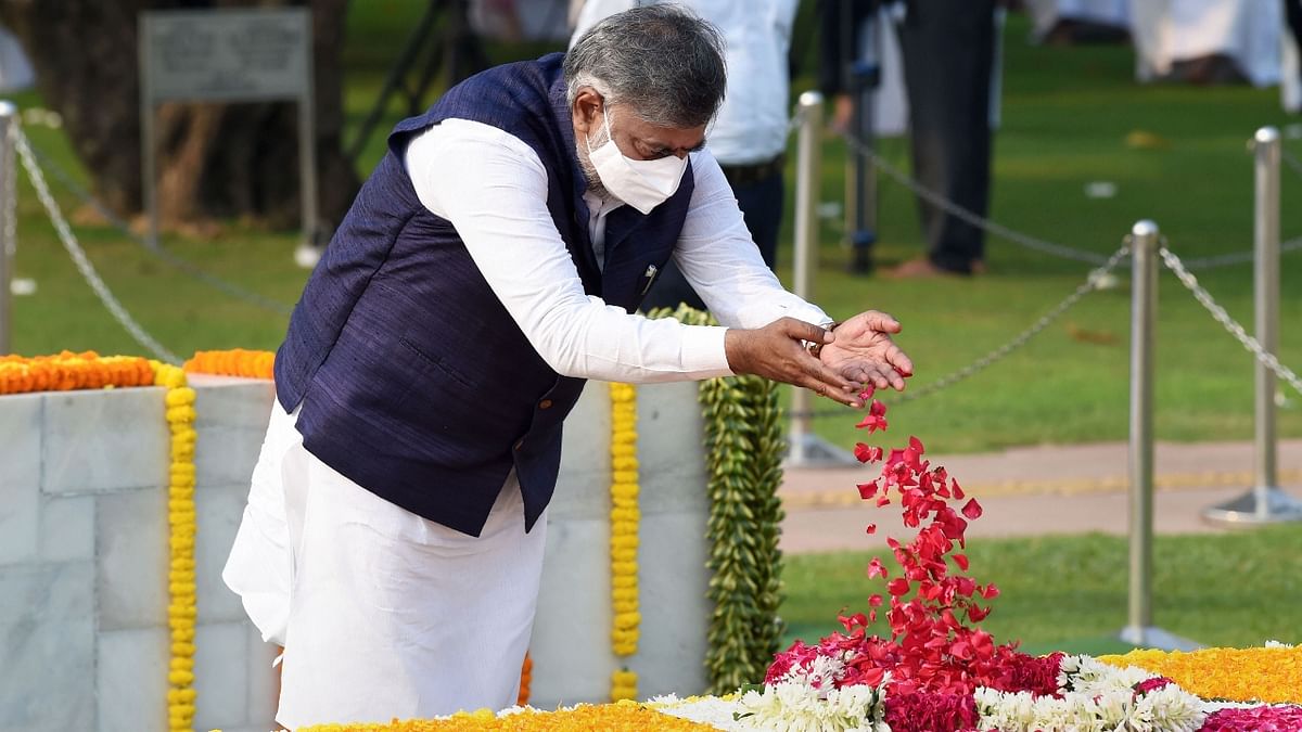 Union Minister of State for Jal Shakti Prahlad Singh Patel pays homage to Mahatma Gandhi at Rajghat in New Delhi. Credit: PTI Photo