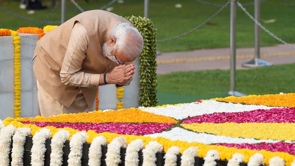 PM Modi pays homage to Mahatma Gandhi on the occasion of his 152nd birth anniversary, at Rajghat in New Delhi. Credit: PTI Photo