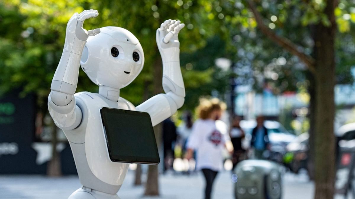 Pepper the robot by SoftBank Robotics dances to music and greets guest as they arrive to the park at the Robot Block Party put on by MassRobotoics in Boston, Massachusetts. Credit: AFP Photo