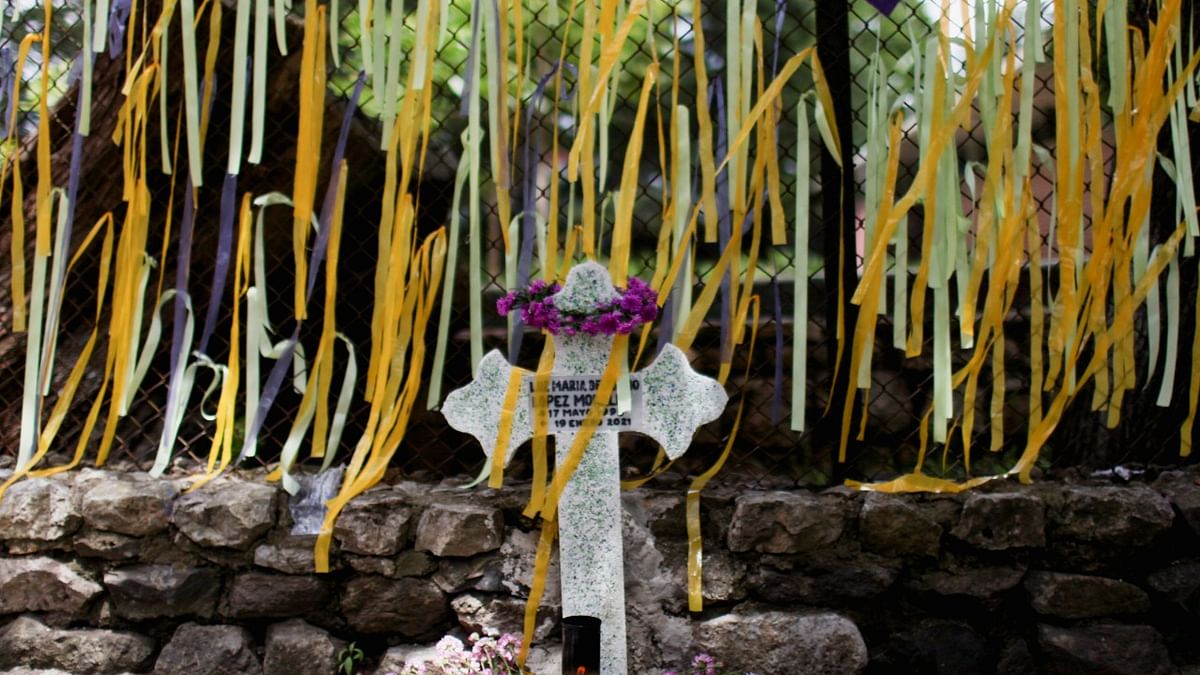 Ribbons are pictured next to a symbolic cross during a tribute to demand justice for Luz Maria Lopez Morales, former prosecutor of the Public Ministry, who was murdered this year, in Guatemala City. Credit: Reuters Photo