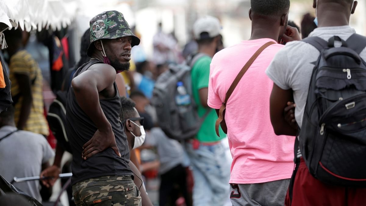 Haitian migrants seeking refuge in the US, are seen outside the Casa INDI shelter as they wait to be processed by the Mexican Commission for Aid to Refugees, in Monterrey. Credit: Reuters Photo